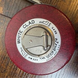 Vintage Lufkin Rule Co. White Clad 50 ft. steel tape measure.